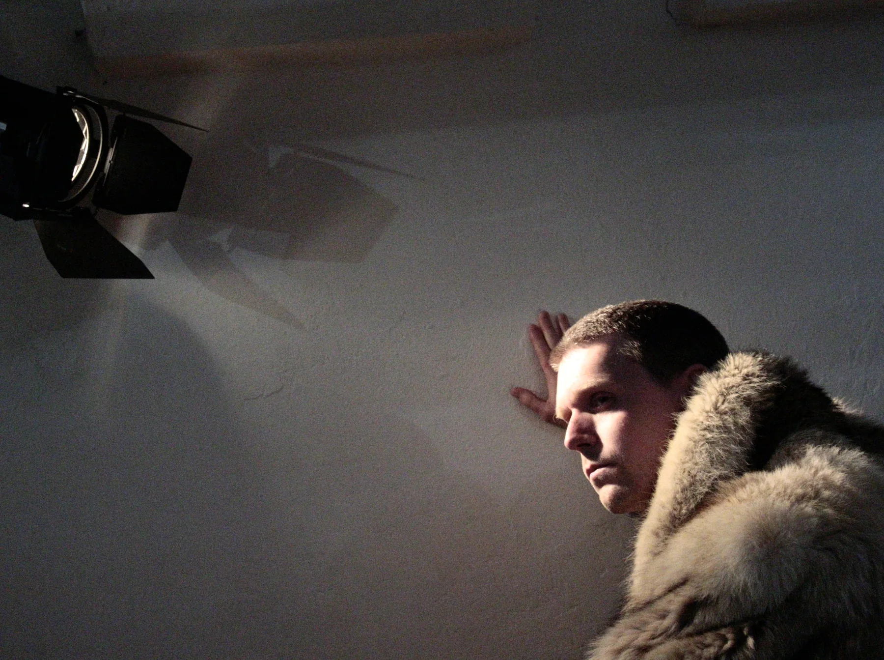 Side-lit performance portrait of Marcus Brody